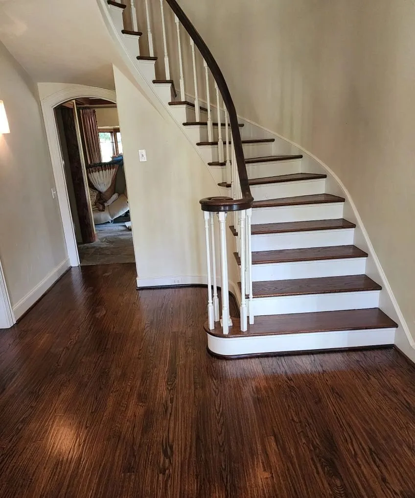 Refinished oak hardwood floor and stair treads in an entry hall, McKinney TX