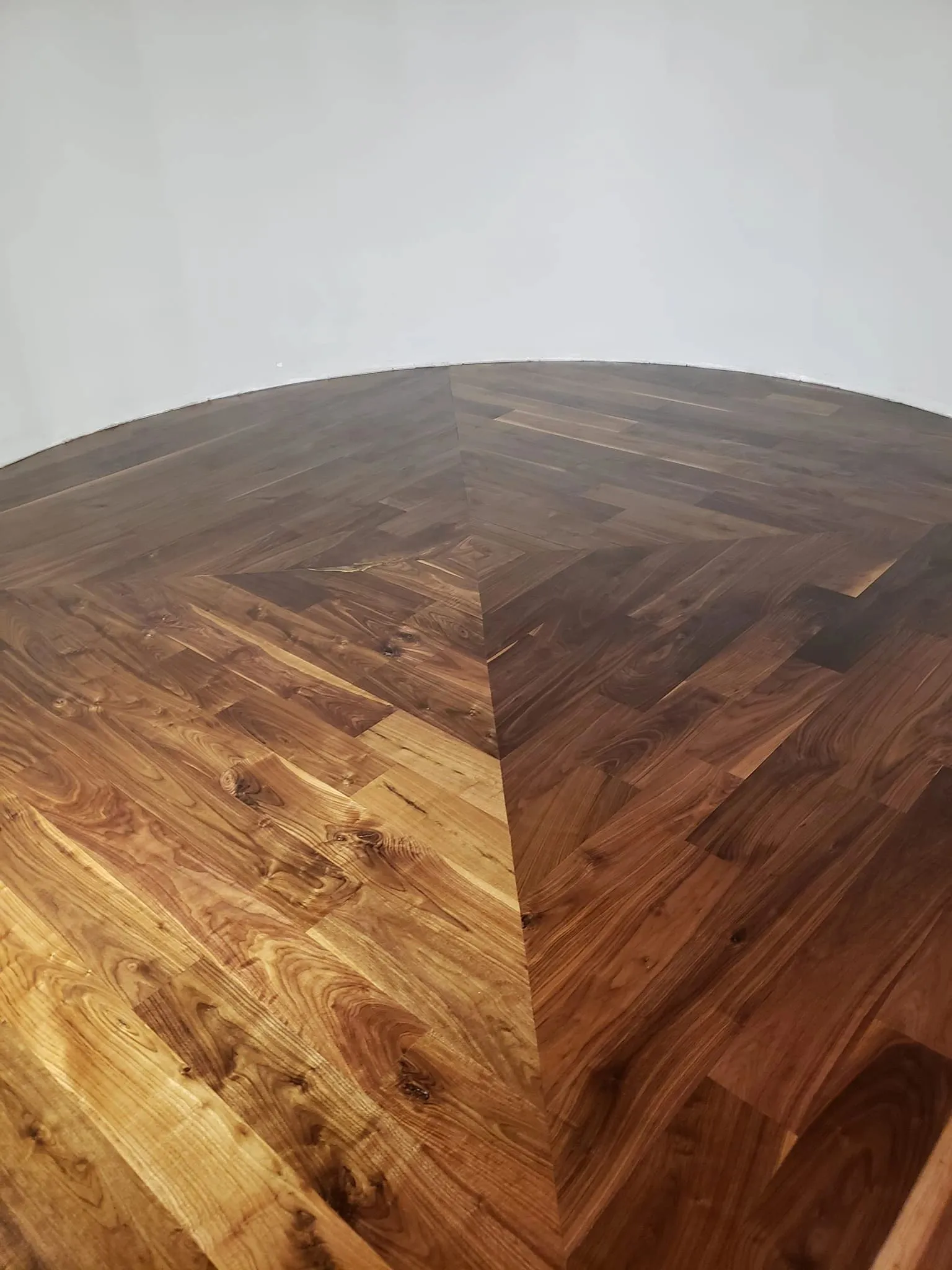 Custom walnut chevron hardwood flooring installed by Artistry Floors in a McKinney, TX home